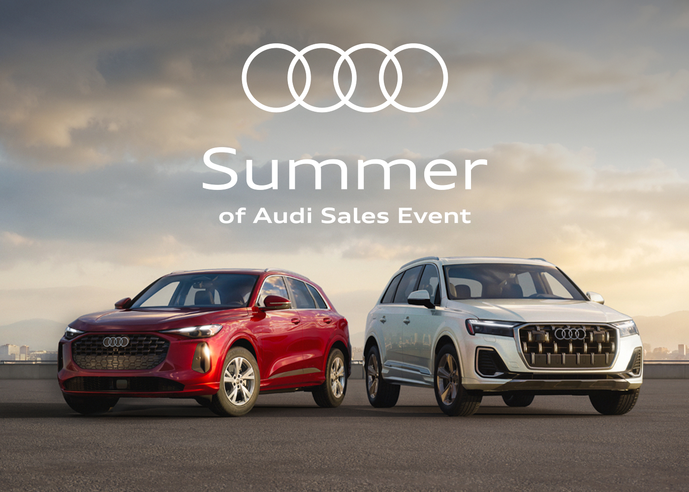 Head-on view of a red Audi Q5 and white Audi Q7 before a vanilla sky. Summer of Audi Sales Event. Find yours.